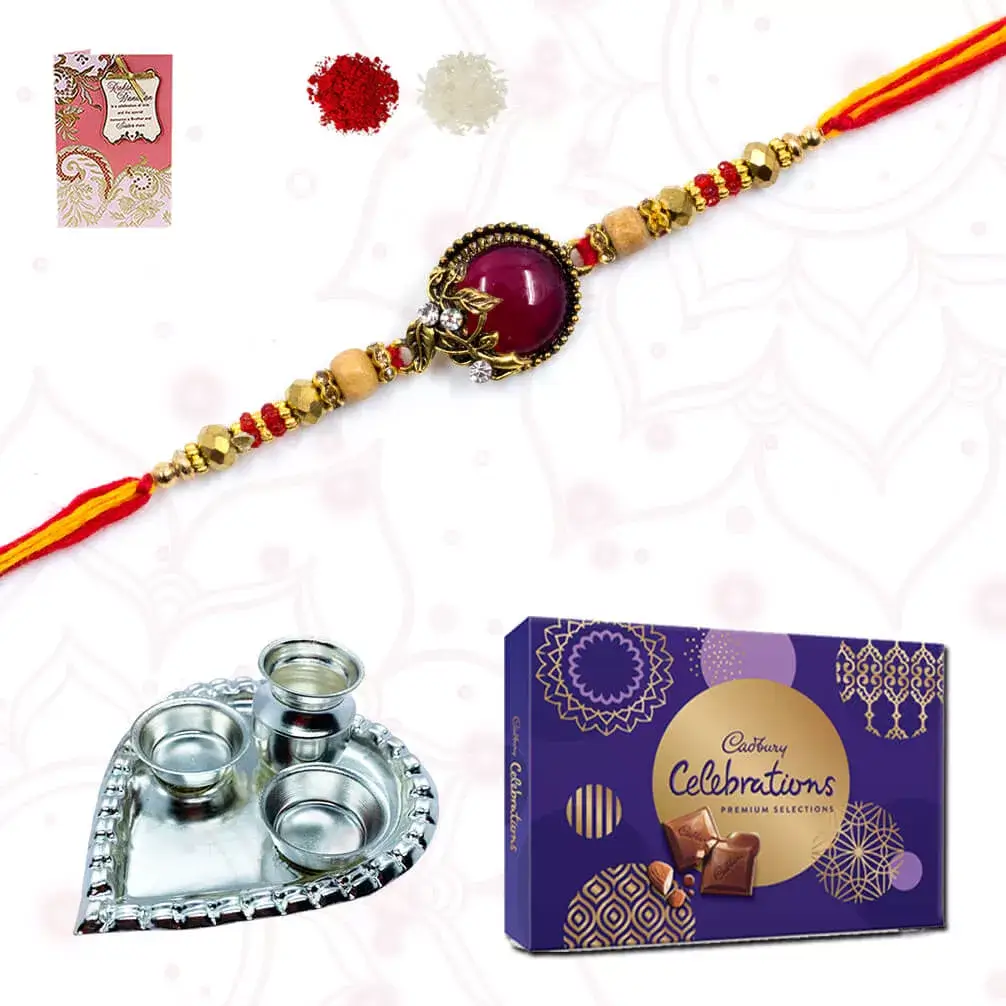 1 Designer RAkhi with 1 cadbury's celebration and Heart shape silver plated special puja thali