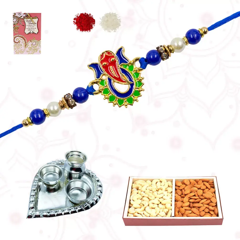 1 Ganesha Rakhi with a box of dry fruits containing CAshews and Raisins with Heart shape silver plated special puja thali