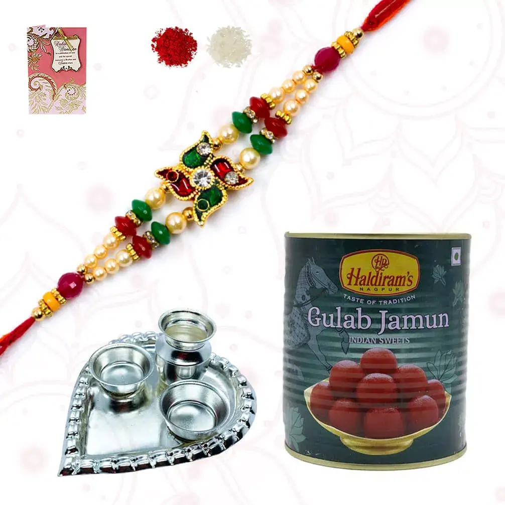 1 Swatik Rakhi with RAsgulla tin 1/2 kg and 1 Heart shape silver plated special puja thali